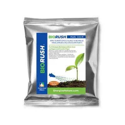 BioRush PLUS root stimulant mixed into a tank sprayer, used to improve plant health, soil biology, and green-up through foliar application.